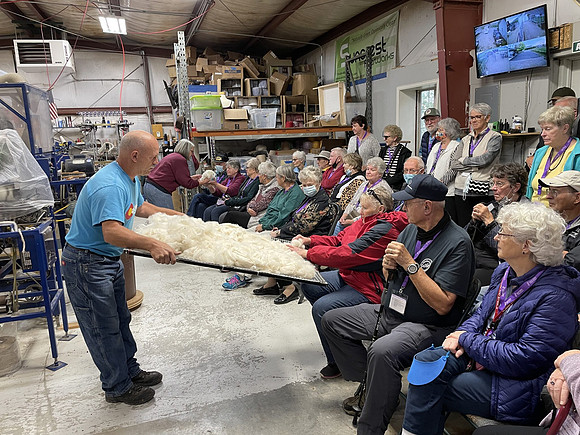 We are in the building where they process fibers.  Mr. "Suncrest" was very informative.  There is a lot that goes into the process after an animal is sheared and you get yarn.