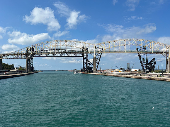 The vertical pieces are part of the railroad bridge.