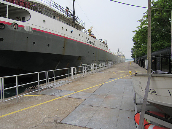 It is a very long ship.  The locks can accommodate vessels up to 1,000 feet.