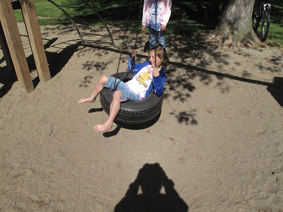 Having fun on the tire swing.