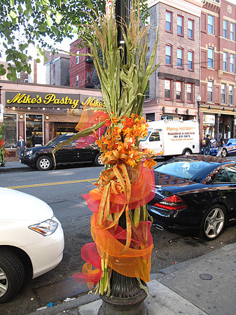 A group of people were out decorating the streets in beautiful fall arrangements like this.