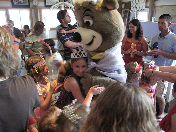 Mya gets a hug from Cindy Bear.