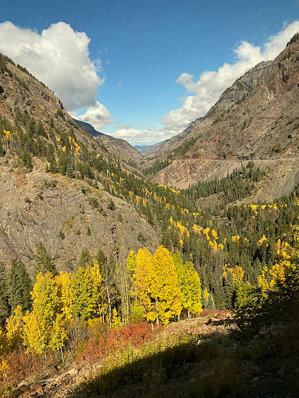 The scenic 25-mile road between Ouray and Silverton is called "the million dollar highway".  It has million dollar views, yes, but it cost a million dollars per mile to build.