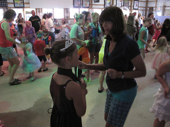 Mya gets a dance with Grandma.