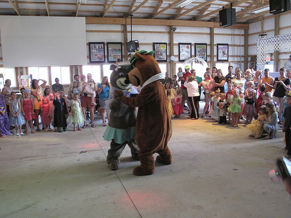 Yogi Bear and Cindy Bear share a dance.